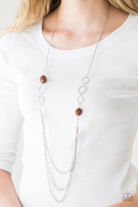 Margarita Masquerades - Brown - Paparazzi Accessories  Faceted brown beads and hammered silver hoops gives way to layers of mismatched silver chains for a whimsical look. Features an adjustable clasp closure.  Sold as one individual necklace. Includes one pair of matching earrings.