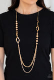 Modern Girl Glam - Gold - Paparazzi Accessories  Dipped in metallic shimmer, a collection of golden crystal-like beads and hammered gold frames give way to layers of mismatched gold chains for a modern look. Features an adjustable clasp closure.  Sold as one individual necklace. Includes one pair of matching earrings.