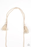 Macrame Mantra - White - Paparazzi Accessories  Soft twine-like cording decoratively knots into a macramé inspired pendant at the bottom of lengthened strands of twisted cording. Featuring frayed ends, excess cording streams from the bottom of the knotted centerpiece, creating an earthy fringe. Features an adjustable sliding knot closure.  Sold as one individual necklace. Includes one pair of matching earrings.