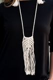 Macrame Mantra - White - Paparazzi Accessories  Soft twine-like cording decoratively knots into a macramé inspired pendant at the bottom of lengthened strands of twisted cording. Featuring frayed ends, excess cording streams from the bottom of the knotted centerpiece, creating an earthy fringe. Features an adjustable sliding knot closure.  Sold as one individual necklace. Includes one pair of matching earrings.