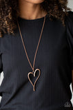 HEARTS So Good - Copper - Paparazzi Accessories - Item #P2WH-CPXX-153XX An asymmetrical copper heart charm swings from the bottom of a lengthened copper chain, creating a whimsical pendant. Features an adjustable clasp closure.  Sold as one individual necklace. Includes one pair of matching earrings.