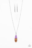 Going Overboard - Purple - Paparazzi Accessories -  Dipped in a purple finish, a wooden teardrop pendant swings from the bottom of a lengthened silver chain for a colorful earthy look. Features an adjustable clasp closure.  Sold as one individual necklace. Includes one pair of matching earrings.