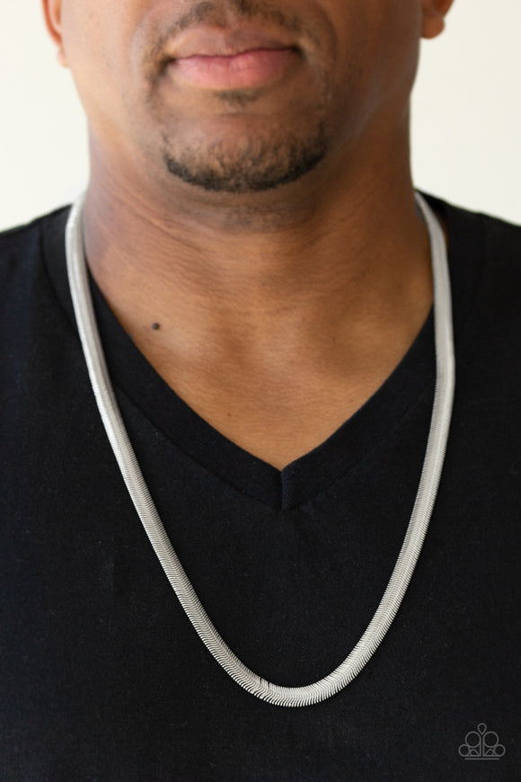 Kingpin - Silver - Paparazzi Accessories -  P2MN-URSV-029XX Featuring a high-sheen finish, a thick silver herringbone chain drapes across the chest for a sleek, upscale look. Features an adjustable clasp closure.  Sold as one individual necklace.