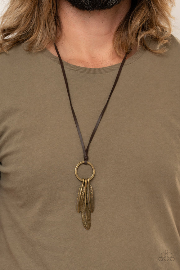 Bird Watcher - Brown - Paparazzi Accessories -  Item #P2UR-BNXX-134XX Mismatched brass feather charms glide along a brass ring at the bottom of an earthy piece of brown leather cording, creating a rustic pendant. Features an adjustable sliding knot closure.  Sold as one individual necklace.