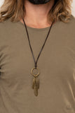 Bird Watcher - Brown - Paparazzi Accessories -  Item #P2UR-BNXX-134XX Mismatched brass feather charms glide along a brass ring at the bottom of an earthy piece of brown leather cording, creating a rustic pendant. Features an adjustable sliding knot closure.  Sold as one individual necklace.