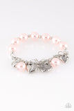 More Amour - Pink - Paparazzi Accessories - Attached to a section of shimmery silver chain, pearly pink and dainty silver beads are threaded along a stretchy band. Mismatched silver heart charms swing from the glistening chain, creating a flirty fringe.   Sold as one individual bracelet.