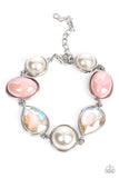 Nostalgically Nautical - Pink - Paparazzi Accessories -  Item #P9RE-PKXX-277EO A collection of classic white pearls, iridescent Pale Rosette beads, and iridescent crystal-like teardrops wrap around the wrist in an ethereal display. Shiny silver frames encase each bead, adding a romantic vibe to the vintage inspired design. Features an adjustable clasp closure.  Sold as one individual bracelet.