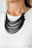 Catwalk Queen - Black - Paparazzi Accessories  Strand after strand of shimmering black seed beads fall together to create a bold statement piece. Features an adjustable clasp closure.  Sold as one individual necklace. Includes one pair of matching earrings.  #P2RE-BKXX-325XX