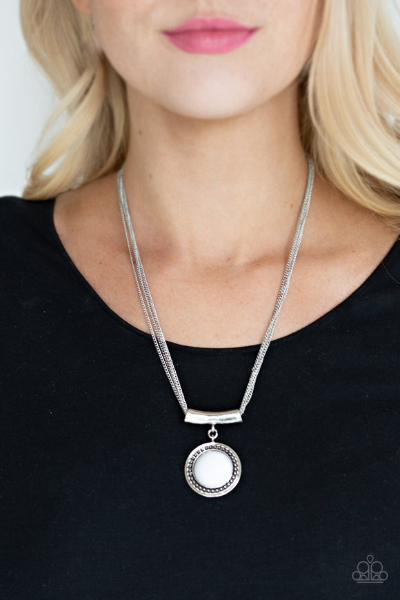 Gypsy Gulf - White - Paparazzi Accessories -  A shiny white bead is pressed into the center of a studded silver frame and attached to a shimmery silver fitting. The colorful pendant slides along four dainty silver chains below the collar for a seasonal look. Features an adjustable clasp closure.  Sold as one individual necklace. Includes one pair of matching earrings.