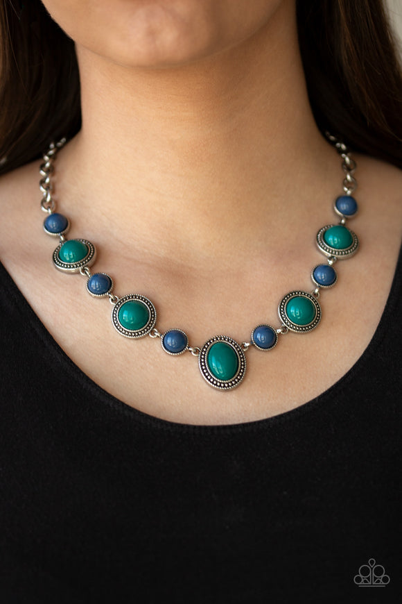 Voyager Vibes - Multi - Paparazzi Accessories  #P2TR-MTXX-054XX  Featuring smooth and studded silver frames, refreshing blue and green beads link below the collar in a seasonal fashion. Features an adjustable clasp closure.  Sold as one individual necklace at DeesBlings.com - Affordable Fashion Jewelry that is Lead and Nickel free. Includes one pair of matching earrings.