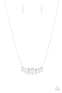 Leading Lady - White - Paparazzi Accessories  #P2RE-WTXX-345XX  Gradually increasing in size near the center, glittery white marquise shaped gems link below the collar for a dramatic look. Features an adjustable clasp closure.  Sold as one individual necklace at DeesBlings.com - Affordable Fashion Jewelry that is Lead and Nickel free. Includes one pair of matching earrings.