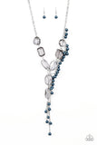 Prismatic Princess - Blue - Paparazzi Accessories -  Featuring an array of shapes and cuts, a collection of faceted smoky gems link below the collar for a glamorous shimmer. A shimmery silver strand of pearly blue beads trickles down one side of the piece, creating a flirtatious extended pendant. Features an adjustable clasp closure.  Sold as one individual necklace. Includes one pair of matching earrings.