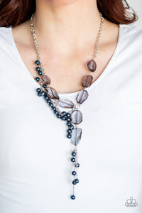 Prismatic Princess - Blue - Paparazzi Accessories -  Featuring an array of shapes and cuts, a collection of faceted smoky gems link below the collar for a glamorous shimmer. A shimmery silver strand of pearly blue beads trickles down one side of the piece, creating a flirtatious extended pendant. Features an adjustable clasp closure.  Sold as one individual necklace. Includes one pair of matching earrings.