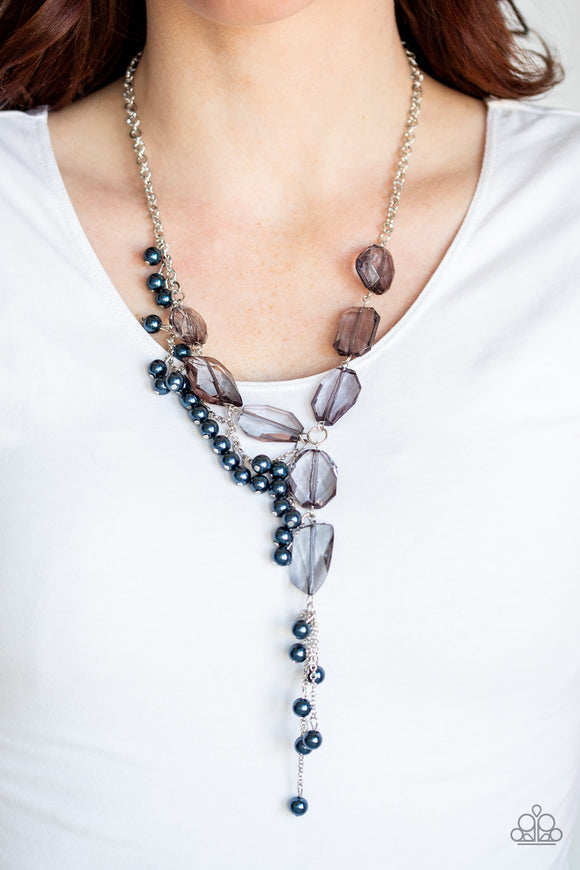 Prismatic Princess - Blue - Paparazzi Accessories -  Featuring an array of shapes and cuts, a collection of faceted smoky gems link below the collar for a glamorous shimmer. A shimmery silver strand of pearly blue beads trickles down one side of the piece, creating a flirtatious extended pendant. Features an adjustable clasp closure.  Sold as one individual necklace. Includes one pair of matching earrings.