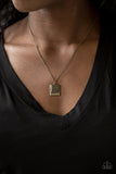 Back To Square One - Brass - Paparazzi Accessories -  A filigree filled brass frame is pressed into a larger hammered frame, creating a dainty pendant below the collar. Features an adjustable clasp closure.  Sold as one individual necklace. Includes one pair of matching earrings.