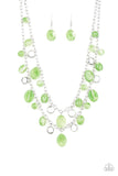 Rainbow Shine - Green - Paparazzi Accessories -  P2WH-GRXX-342XX  Infused with flat silver beads, an array of glassy green beads dangle from the bottoms of two shimmery silver chains, creating a whimsically layered fringe below the collar. Features an adjustable clasp closure.  Sold as one individual necklace. Includes one pair of matching earrings.