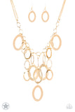 A Golden Spell - Paparazzi Accessories  Large gold links and shimmering textured gold rings cascade below a gold chain freely, allowing for movement that makes a bold statement. Features an adjustable clasp closure.  Sold as one individual necklace. Includes one pair of matching earring.