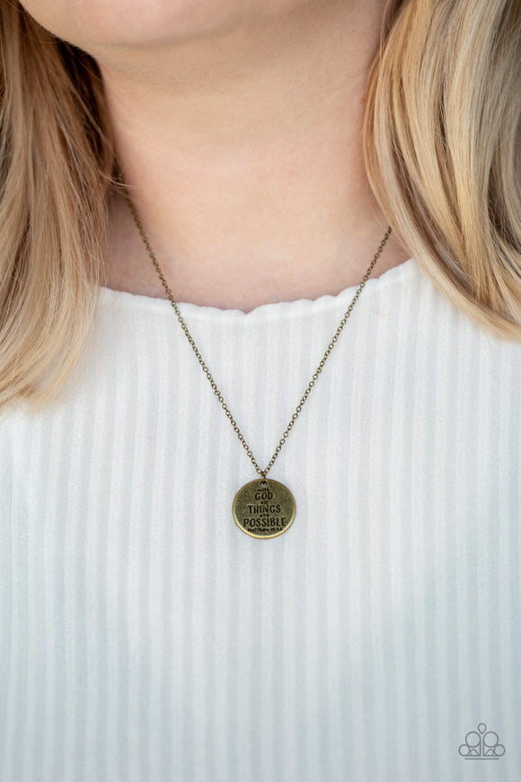 All Things Are Possible - Brass - Paparazzi Accessories  Brushed in an antiqued finish, a dainty brass pendant is stamped in the inspirational phrase, 