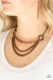 CHAINS of Command - Copper - Paparazzi Accessories  Ornate copper hoops give way to mismatched copper chains below the collar for an edgy industrial look. Features an adjustable clasp closure.  Sold as one individual necklace. Includes one pair of matching earrings.