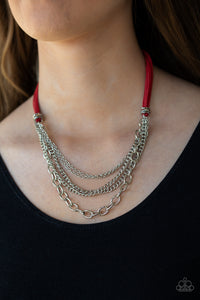 Free Roamer - Red - Paparazzi Accessories  Suspended between strips of fiery red suede, mismatched strands of silver layer below the collar for a spunky industrial look. Features an adjustable clasp closure.  Sold as one individual necklace. Includes one pair of matching earrings.