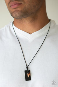 Mountain Scout - Multi - Paparazzi Accessories  A piece of black leather, dainty black and orange stone pendants are knotted at the bottom of a shiny black cord for an urban look. Features an adjustable sliding knot closure.  Sold as one individual necklace.