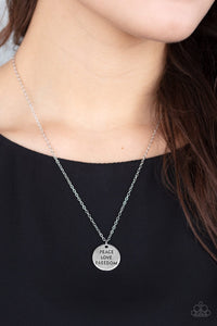 Freedom Isn't Free - Silver - Paparazzi Accessories  Stamped in the words, "Peace," "Love," and "Freedom," a shiny silver disc slides along a dainty silver chain below the collar for a patriotic inspired fashion. Features an adjustable clasp closure.  Sold as one individual necklace. Includes one pair of matching earrings.  P2WD-SVXX-245XX