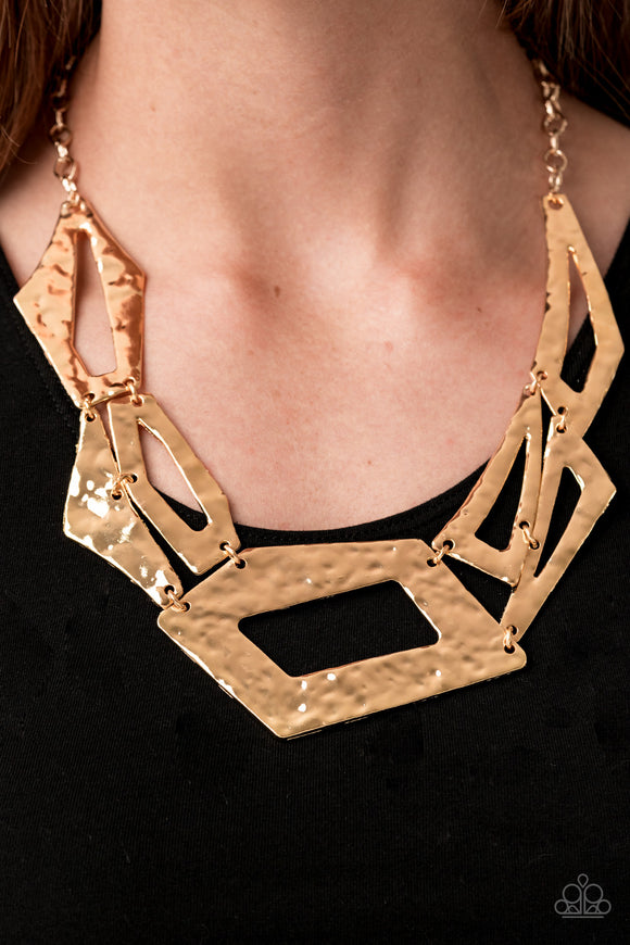 Break The Mold - Gold Attached to an edgy gold chain, hammered gold plates featuring asymmetrical shapes abstractly link below the collar for a knockout look. Features an adjustable clasp closure.  Sold as one individual necklace. Includes one pair of matching earrings.  2020 Convention