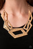 Break The Mold - Gold Attached to an edgy gold chain, hammered gold plates featuring asymmetrical shapes abstractly link below the collar for a knockout look. Features an adjustable clasp closure.  Sold as one individual necklace. Includes one pair of matching earrings.  2020 Convention