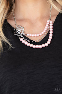 PAPARAZZI ACCESSORIES - Fabulously Floral - Pink Dotted with a glassy white rhinestone center, an airy silver floral frame gives way to layers of pink pearls and a shiny row of silver chain below the collar for a whimsically refined look. Features an adjustable clasp closure.  Sold as one individual necklace. Includes one pair of matching earrings.