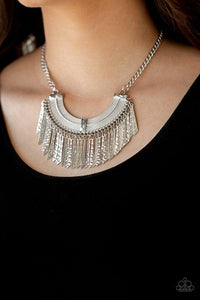 Impressively Incan - Silver - Paparazzi Accessories HAMMERED IN SHIMMERY TEXTURES, FLARED SILVER PLATES SWING FROM THE BOTTOM OF AN ORNATE HALF-MOON FRAME, CREATING AN EDGY FRINGE BELOW THE COLLAR. FEATURES AN ADJUSTABLE CLASP CLOSURE. Sold as one individual necklace. Includes one pair of matching earrings. (Egyptian, tribal)