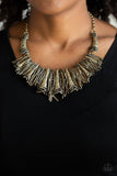 In The MANE-stream - Brass - Paparazzi Accessories  BRUSHED IN AN ANTIQUED SHIMMER, A COLLISION OF GLISTENING BRASS BARS AND HAMMERED BRASS ACCENTS COALESCE INTO AN ABSTRACT STATEMENT PIECE BELOW THE COLLAR FOR A FIERCE INDUSTRIAL LOOK. FEATURES AN ADJUSTABLE CLASP CLOSURE. Sold as one individual necklace. Includes one pair of matching earrings.