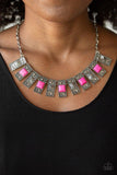 The MANE Contender - Pink - Paparazzi Accessories  DOTTED WITH SQUARE PINK STONES AND PYRAMIDAL BEADED CENTERS, STUDDED RECTANGULAR FRAMES FAN OUT BELOW THE COLLAR FOR A TRENDY TRIBAL LOOK. FEATURES AN ADJUSTABLE CLASP CLOSURE. Sold as one individual necklace. Includes one pair of matching earrings.