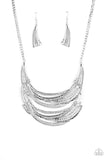 Read Between the VINES - Silver Stamped in sections of vine-like patterns, abstract hammered plates and overlapping silver bars link into an exaggerated pendant below the collar for a statement-making look. Features an adjustable clasp closure.  Sold as one individual necklace. Includes one pair of matching earrings.