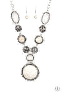 Sedona Drama - White - Paparazzi Accessories - Item #P2SE-WTXX-188XX Featuring floral, textured, and refreshing white stone accents, a collection of unique silver frames link below the collar for a seasonal flair. A dramatically oversized white stone pendant dangles from the bottom for an eye-catching finish. Features an adjustable clasp closure.  Sold as one individual necklace. Includes one pair of matching earrings