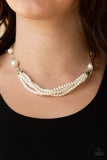 One-WOMAN Show - White - Paparazzi Accessories -  Item #P2RE-WTXX-334XX Oversized white pearls and crystal-like beads give way to layers of beaded pearl strands below the collar for a timeless look. Features an adjustable clasp closure.  Sold as one individual necklace. Includes one pair of matching earrings.