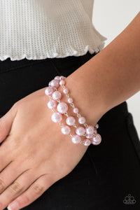 Until The End Of TIMELESS - Pink - Paparazzi Accessories -  Varying in size, classic pink pearls link around the wrist creating three strands for a timelessly layered look. Features an adjustable clasp closure.  Sold as one individual bracelet.