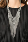 Commanding - 2020 Zi Signature - Paparazzi Accessories -  Suspended from the bottom of thickly layered chains, a rebellious mesh of silver links connect into an edgy V-shaped net. Tiers of dainty silver chains drape from the bottom of the net, creating radically layered shimmer across the chest. Features an adjustable clasp closure.  Sold as one individual necklace. Includes one pair of matching earrings.