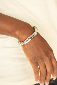 Be Prayerful - Purple Infused with dainty silver accents, a collection of glassy purple and green stone beads and a shimmery silver frame stamped in the phrase, "Be Prayerful", are threaded along a stretchy band around the wrist for an inspirational look. Color may vary.  Sold as one individual bracelet.