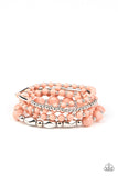 Vibrantly Vintage - Pink - Paparazzi Accessories Item #P9WH-PKXX-250XX Infused with dainty silver beads, a mismatched collection of Rose Tan and shiny silver beads are threaded along stretchy bands around the wrist for a colorfully layered look.  Sold as one set of five bracelets.