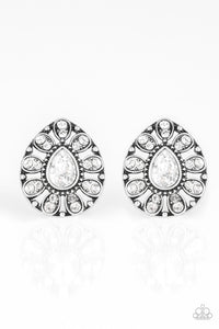 Treasure Retreat - White - Paparazzi Accessories -  P5PO-WTXX-176XX  A teardrop silver frame is encrusted in glittery white rhinestones, creating a sparkling floral frame. Earring attaches to a standard post fitting.  Sold as one pair of post earrings at DeesBlings.com - Affordable Fashion Jewelry that is Lead and Nickel free.