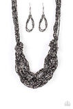 City Catwalk - Black - Paparazzi Accessories -   Brushed in a flashy finish, countless strands of black and gunmetal seed beads weave into a bulky square braid below the collar for a glamorous look. Features an adjustable clasp closure.  Sold as one individual necklace. Includes one pair of matching earrings.