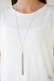 Socialite Of The Season - Pink - Paparazzi Accessories  A glittery pink crystal-like bead swings from the bottom of a lengthened silver chain, giving way to a shimmering silver tassel for a glamorous finish. Features an adjustable clasp closure.  Sold as one individual necklace. Includes one pair of matching earrings.