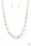 Uptown Heiress - Pink - Paparazzi Accessories -  Infused with dainty silvery rhinestone encrusted beads, a refined collection of oversized ight pink silver pearls are threaded along an invisible wire below the collar for a timeless dazzle. Features an adjustable clasp closure.  Sold as one individual necklace with matching earrings.