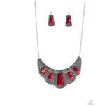 Lion Den - Red - Paparazzi Accessories -  Featuring faceted emerald style cuts, bold geometric red beads are pressed into studded silver frames that dramatically link below the collar for a fierce finish. Features an adjustable clasp closure.  Sold as one individual necklace. Includes one pair of matching earrings.