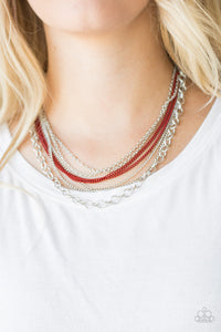 Intensely Industrial - Red - Paparazzi Accessories -  Painted in a robust finish, shiny red chains join a collision of silver chains below the collar for a daring industrial look. Features an adjustable clasp closure.  Sold as one individual necklace. Includes one pair of matching earrings.