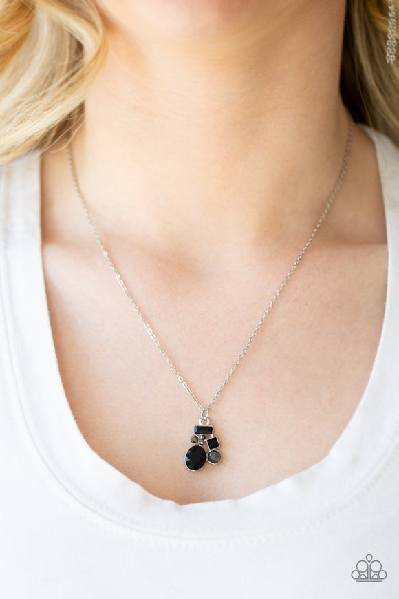 Time To Be Timeless - Black Varying in shape and size, glittery black and hematite rhinestones coalesce into a sparkling pendant below the collar for a timeless look. Features an adjustable clasp closure.  Sold as one individual necklace. Includes one pair of matching earrings.